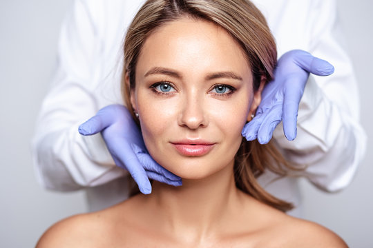 Woman's face being examined by the doctor